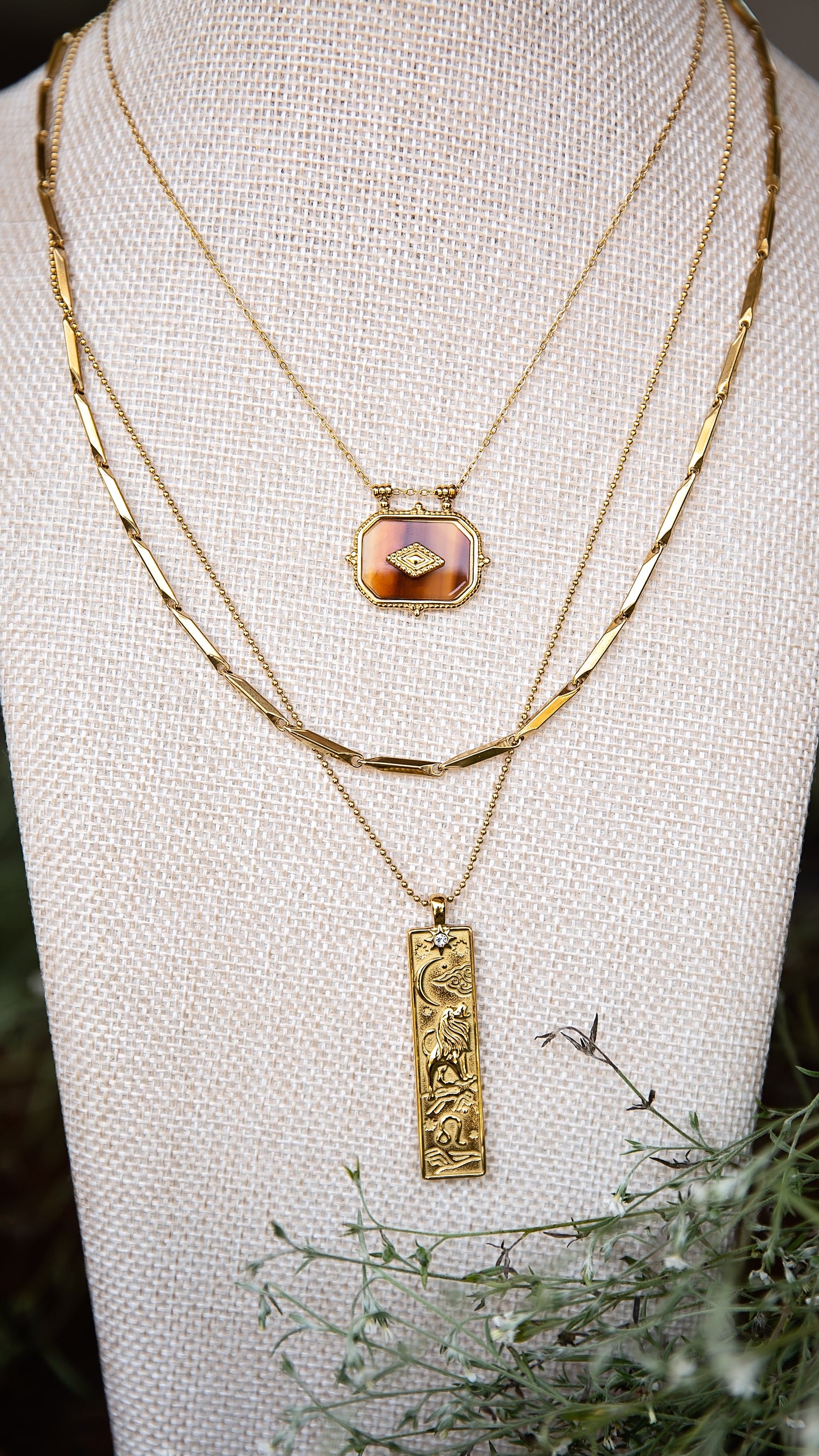 VEITA Jewelry Alchemy Collection Fall 2026 layered necklace look featuring the Ambra Necklace with gold chains