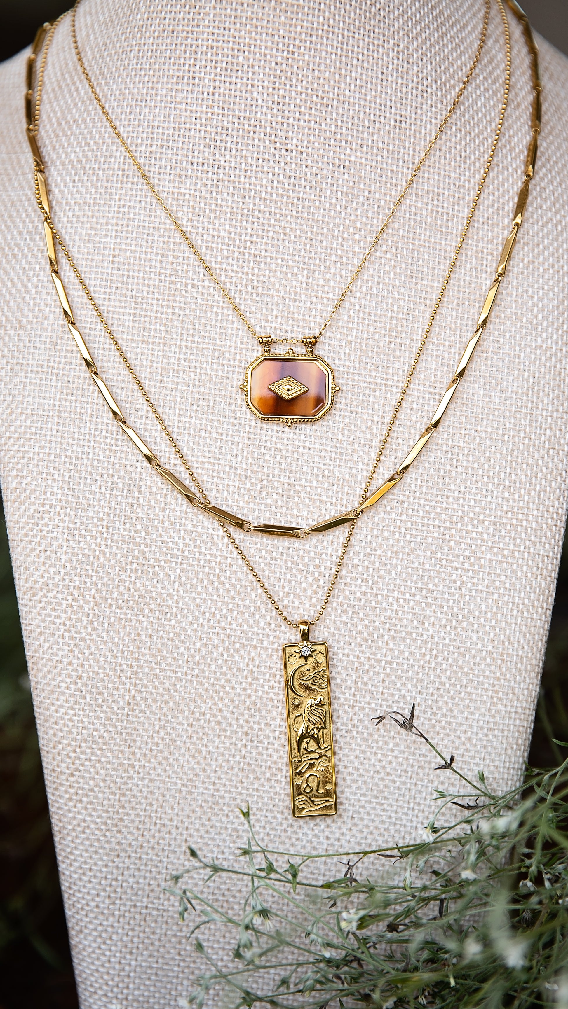 VEITA Jewelry Alchemy Collection Fall 2026 layered necklace look featuring the Ambra Necklace with gold chains