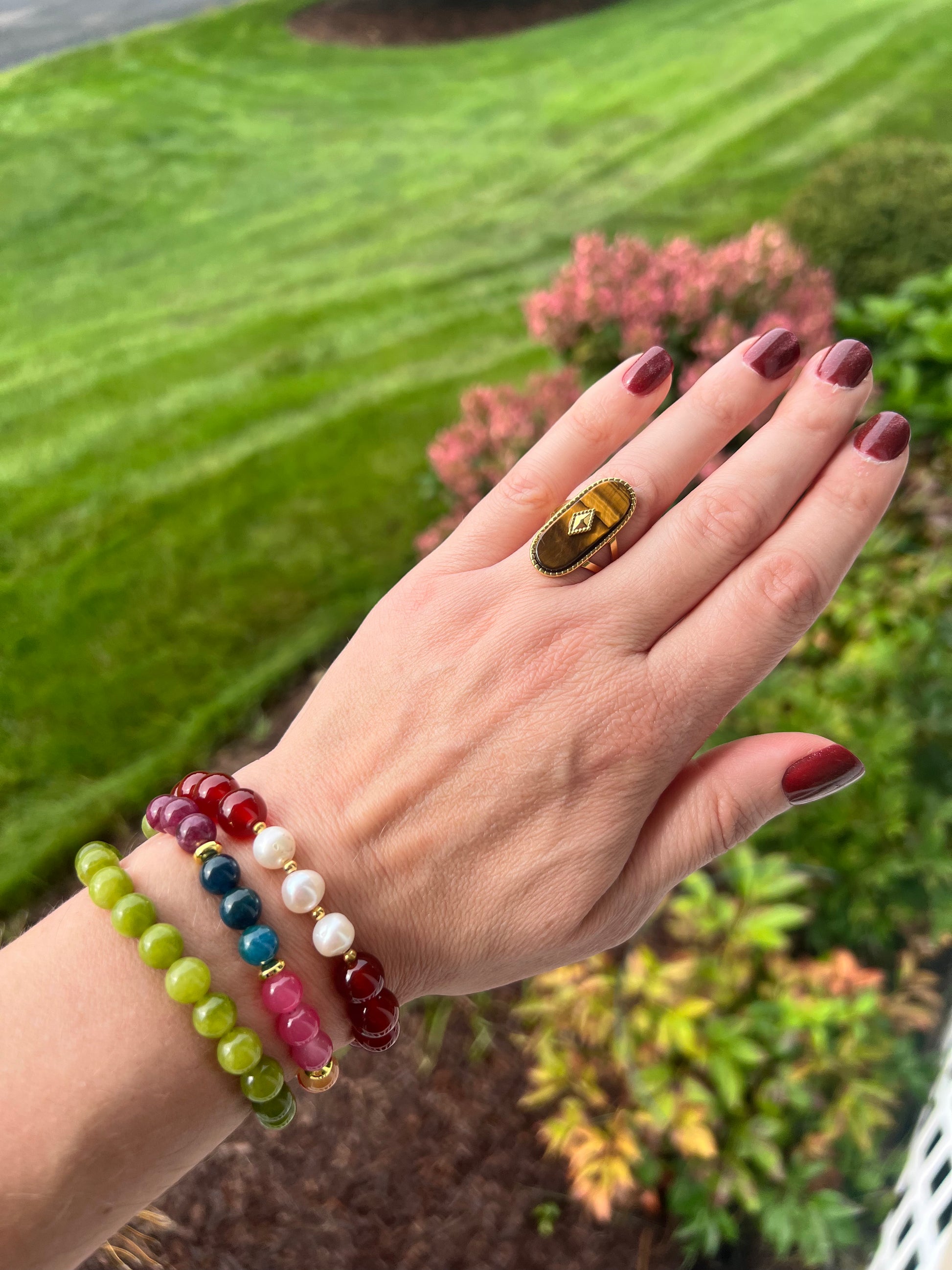 Colorful bracelets layered on the wrist from the VEITA Jewelry Alchemy Collection Fall 2026