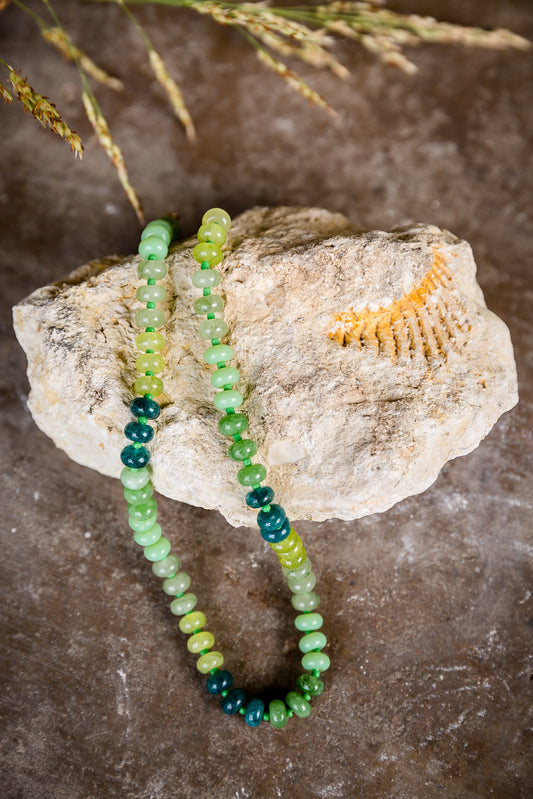 VEITA Jewelry Arden Necklace with genuine green stones and hand-knotted detailing displayed on natural stone