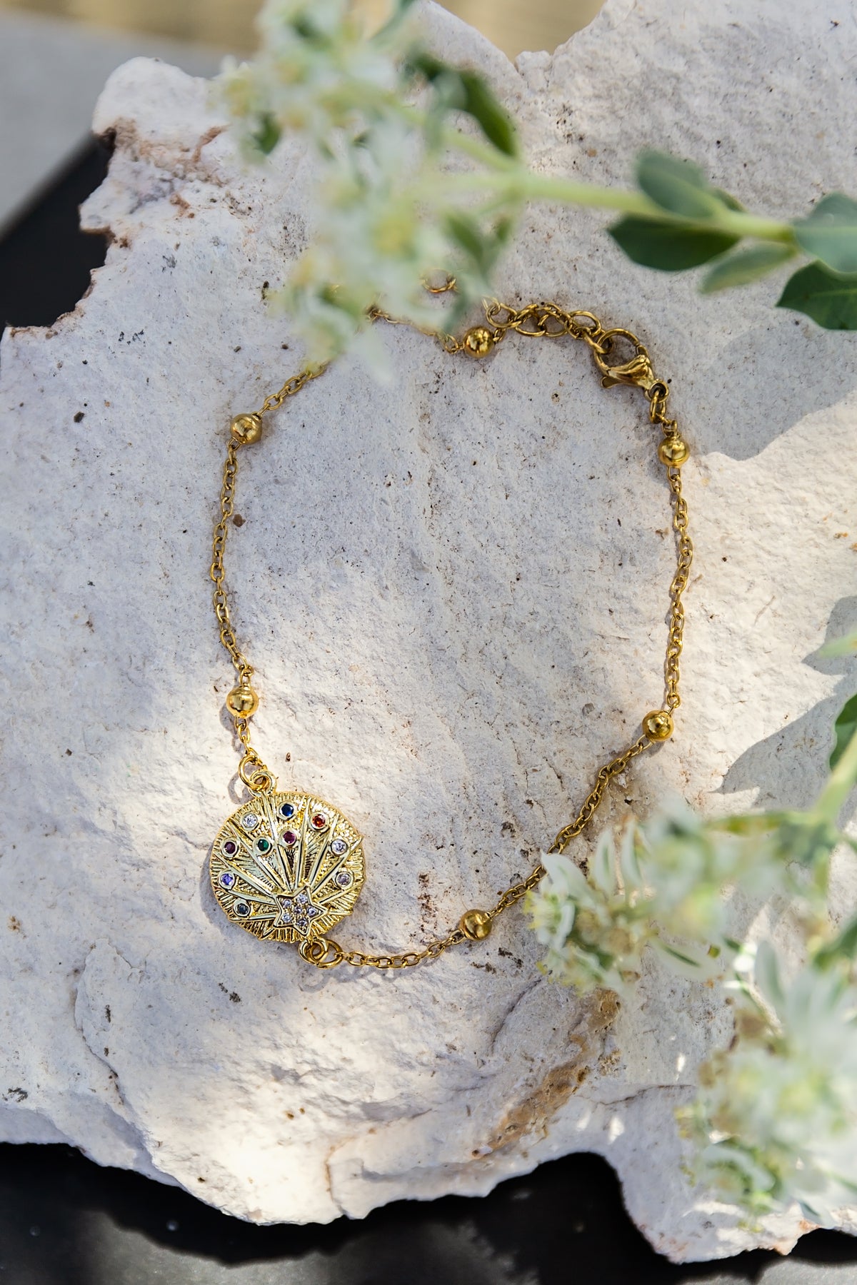 Astra Anklet from the LUNA Collection by VEITA Jewelry featuring colorful zircon stones and a celestial-inspired charm on an 18kt gold-plated chain.