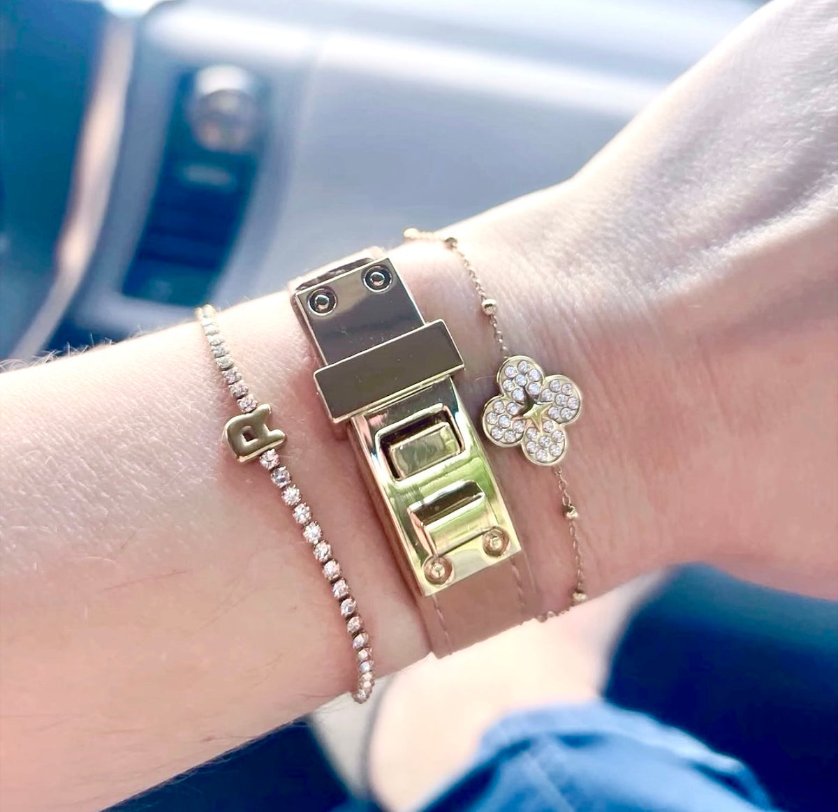 VEITA Jewelry Clover Bracelet styled in a layered gold bracelet stack