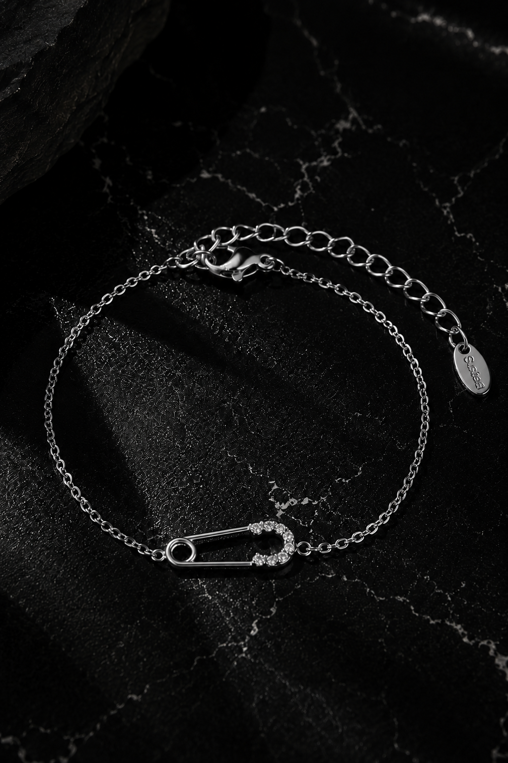 Delicate Salama Bracelet in silver featuring a minimalist safety pin bracelet crafted from durable stainless steel with zircon stone accents.