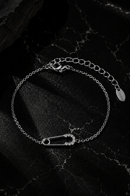 Delicate Salama Bracelet in silver featuring a minimalist safety pin bracelet crafted from durable stainless steel with zircon stone accents.