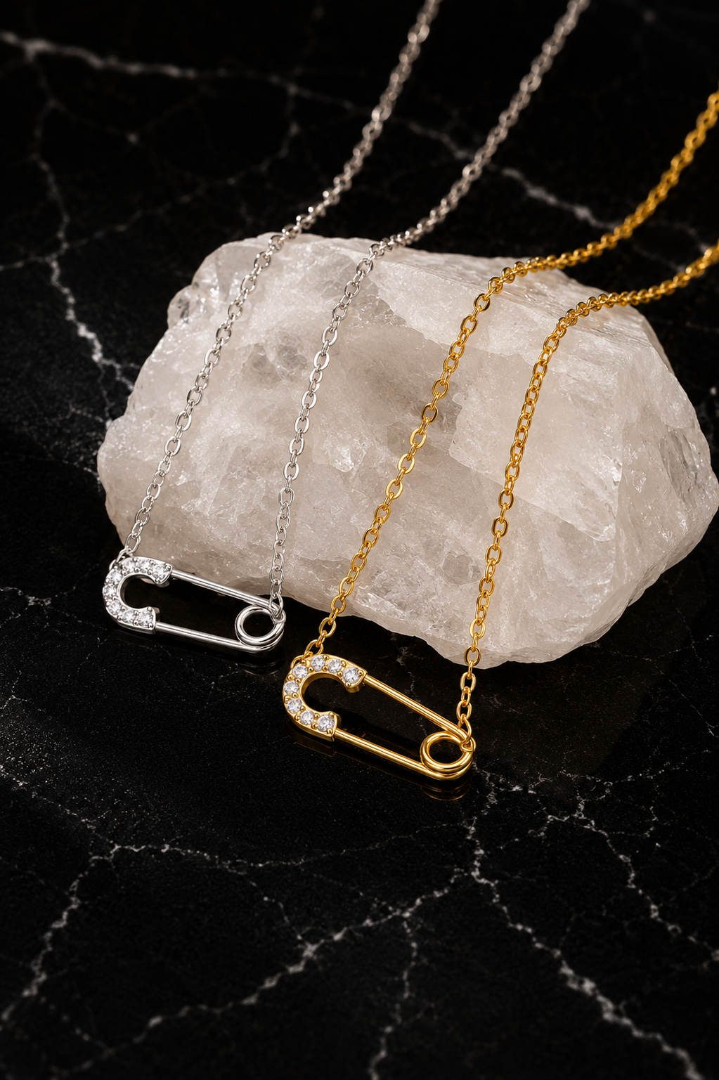 Delicate Salama Necklace featuring a minimalist safety pin pendant in gold and silver finishes crafted from stainless steel with delicate zircon accents.