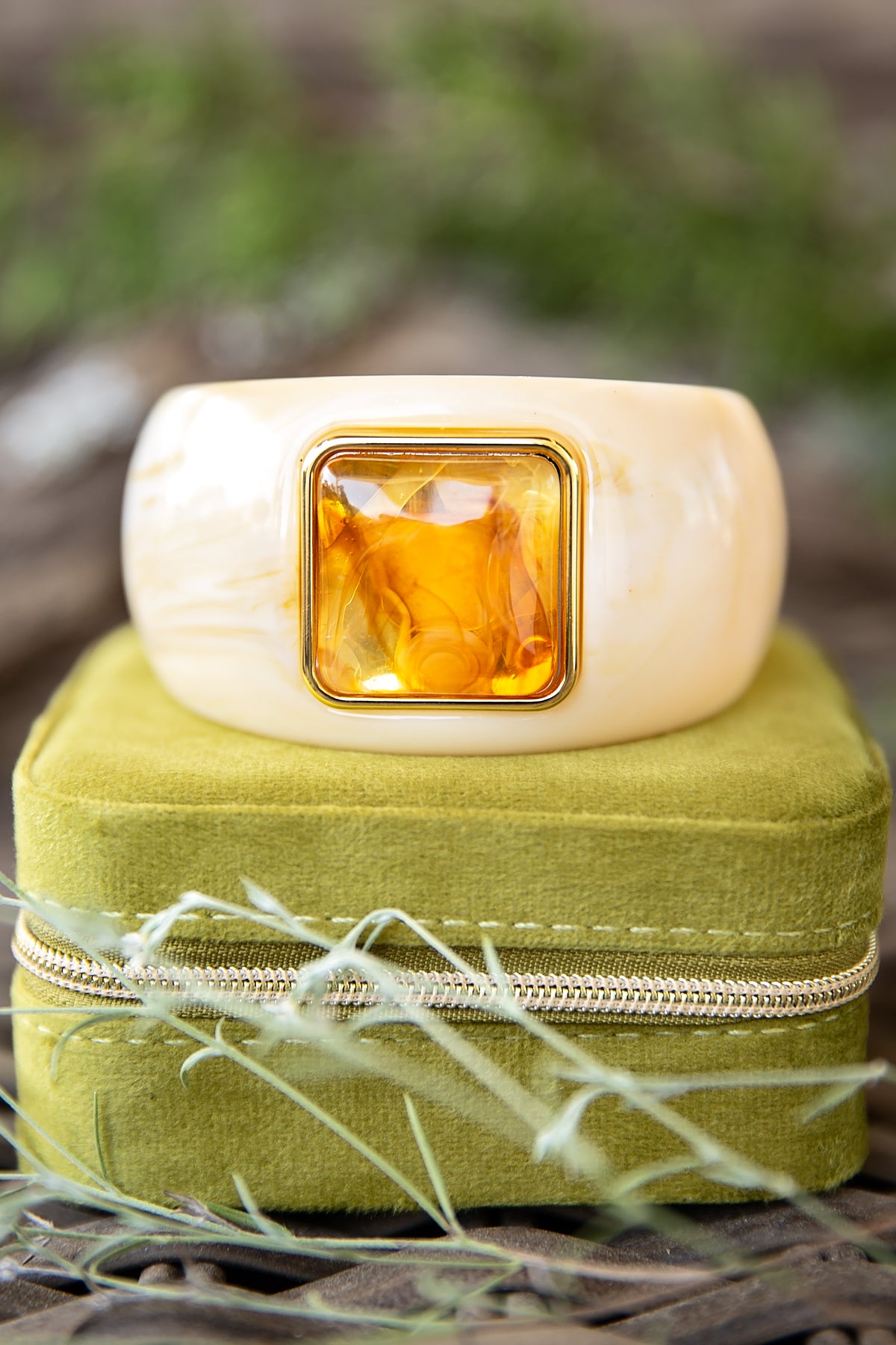 VEITA Jewelry Dune Bangle close-up featuring sculptural ivory resin and amber-toned center detail