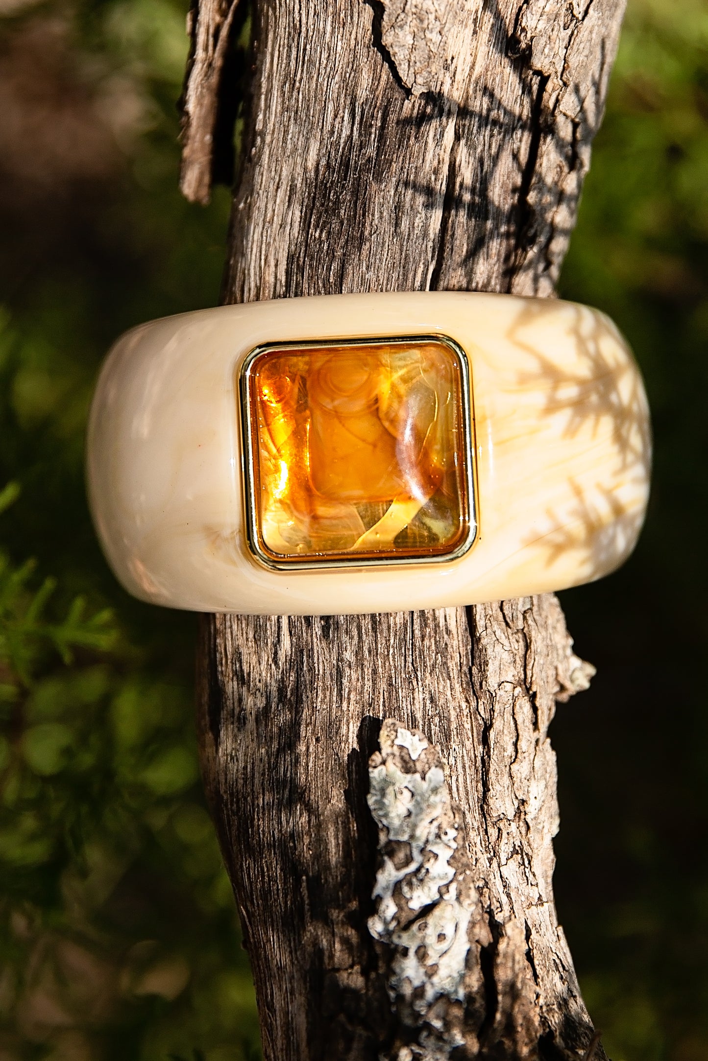 VEITA Jewelry Dune Bangle featuring ivory resin with a warm amber center detail