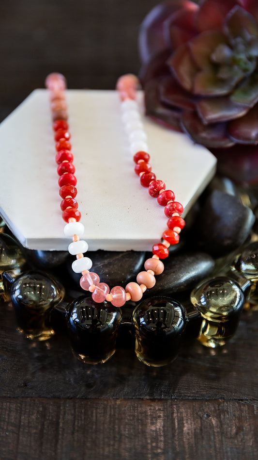 VEITA Jewelry Ember Necklace featuring hand-beaded red, coral, pink and cream gemstones