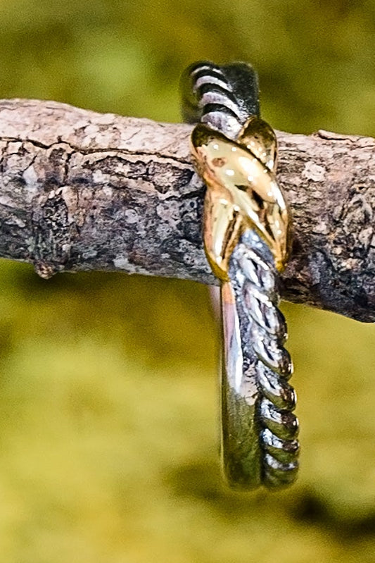 Halara gold ring styled with multiple rings on branch featuring 18kt gold plating and minimalist stackable design