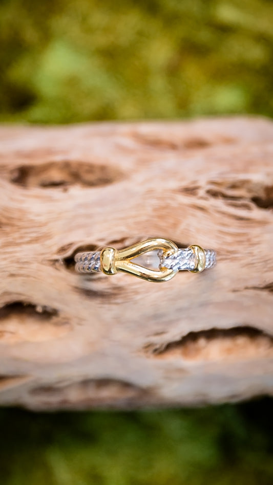Hames gold knot ring featuring two tone stainless steel with 18kt gold plating and textured band detail