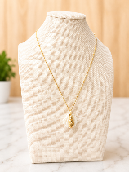 Il Tesoro Necklace displayed on a jewelry bust highlighting its delicate gold chain and mother of pearl pendant.
