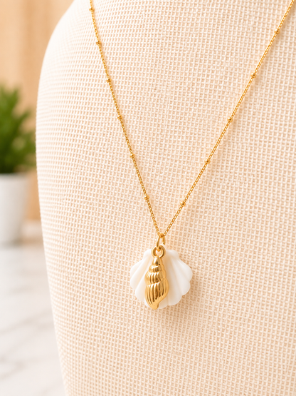 Close-up of the Il Tesoro Necklace showcasing its iridescent mother of pearl pendant with polished gold detailing.