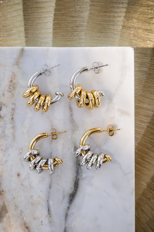 Inez hoop earrings featuring mixed metal charms in gold and silver tones with removable ring design