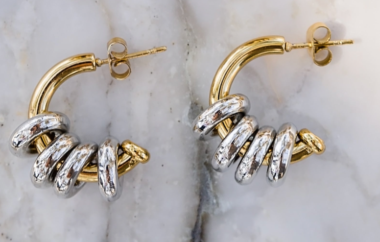 Inez hoop earrings close up showing layered gold and silver rings for a bold textured look