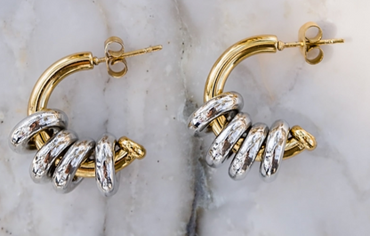 Inez hoop earrings close up showing layered gold and silver rings for a bold textured look