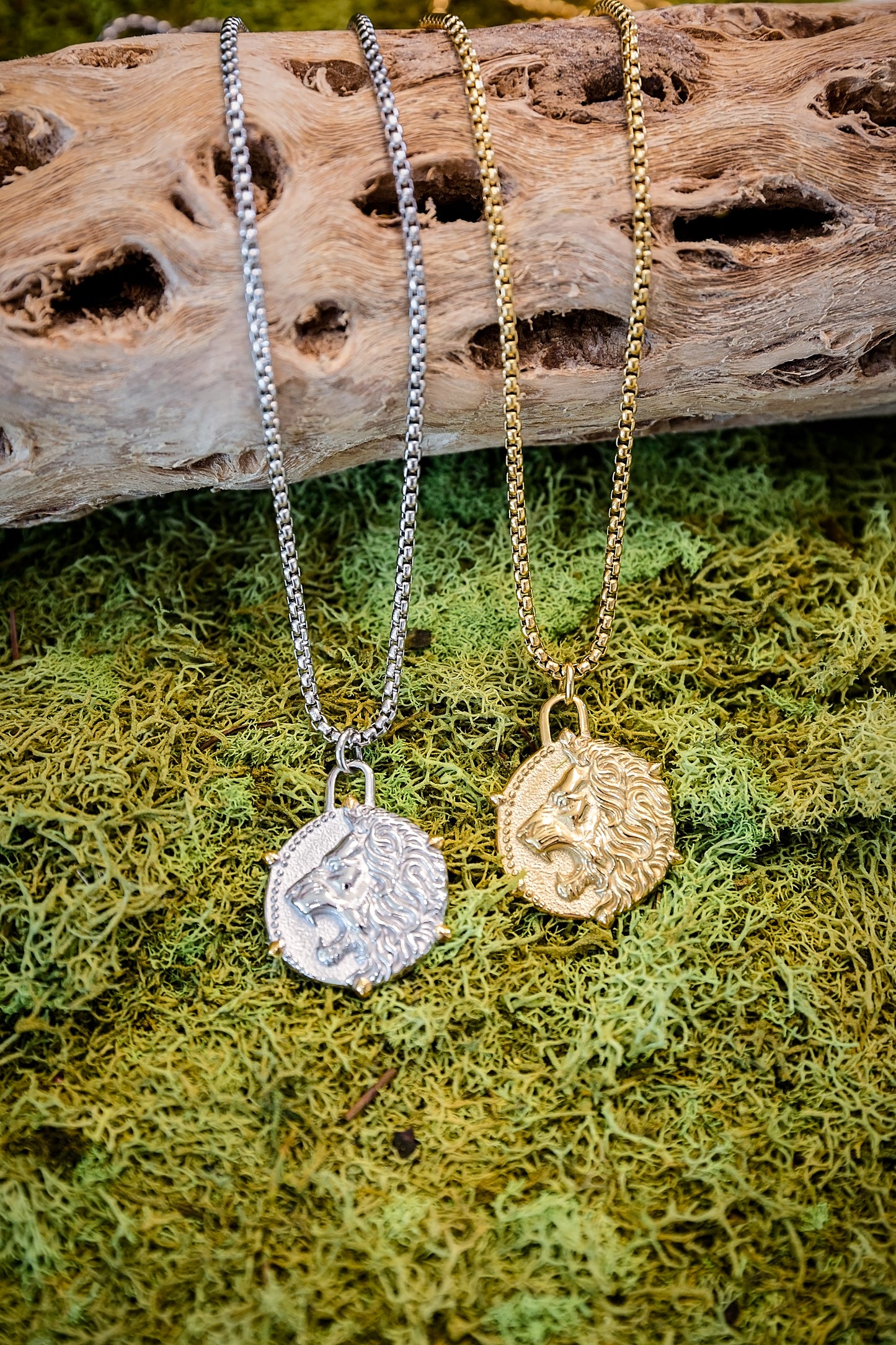 Gold and silver necklaces with mother of pearl pendant and pearl charm displayed on moss background