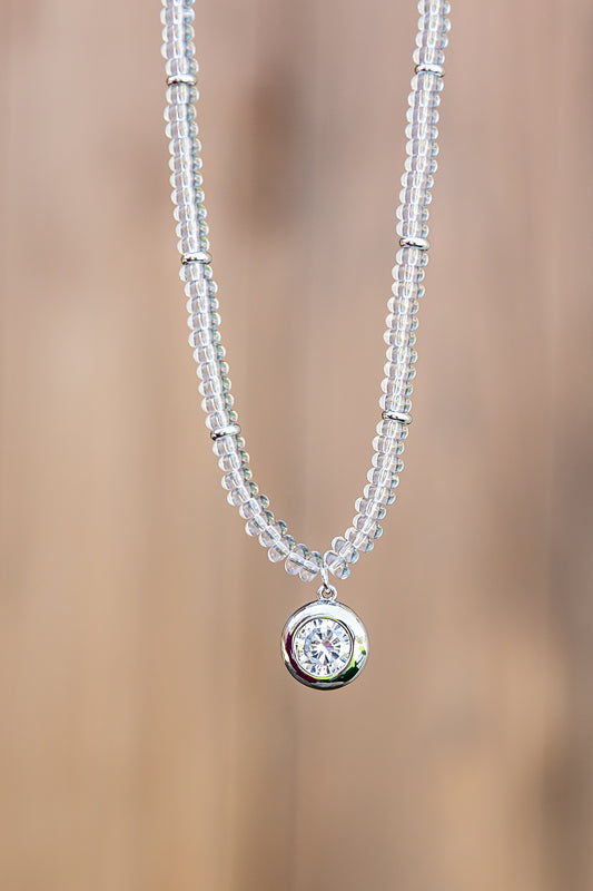 Luna Beaded Necklace by VEITA Jewelry featuring hand-strung clear glass beads and a round genuine zircon pendant with platinum plating.