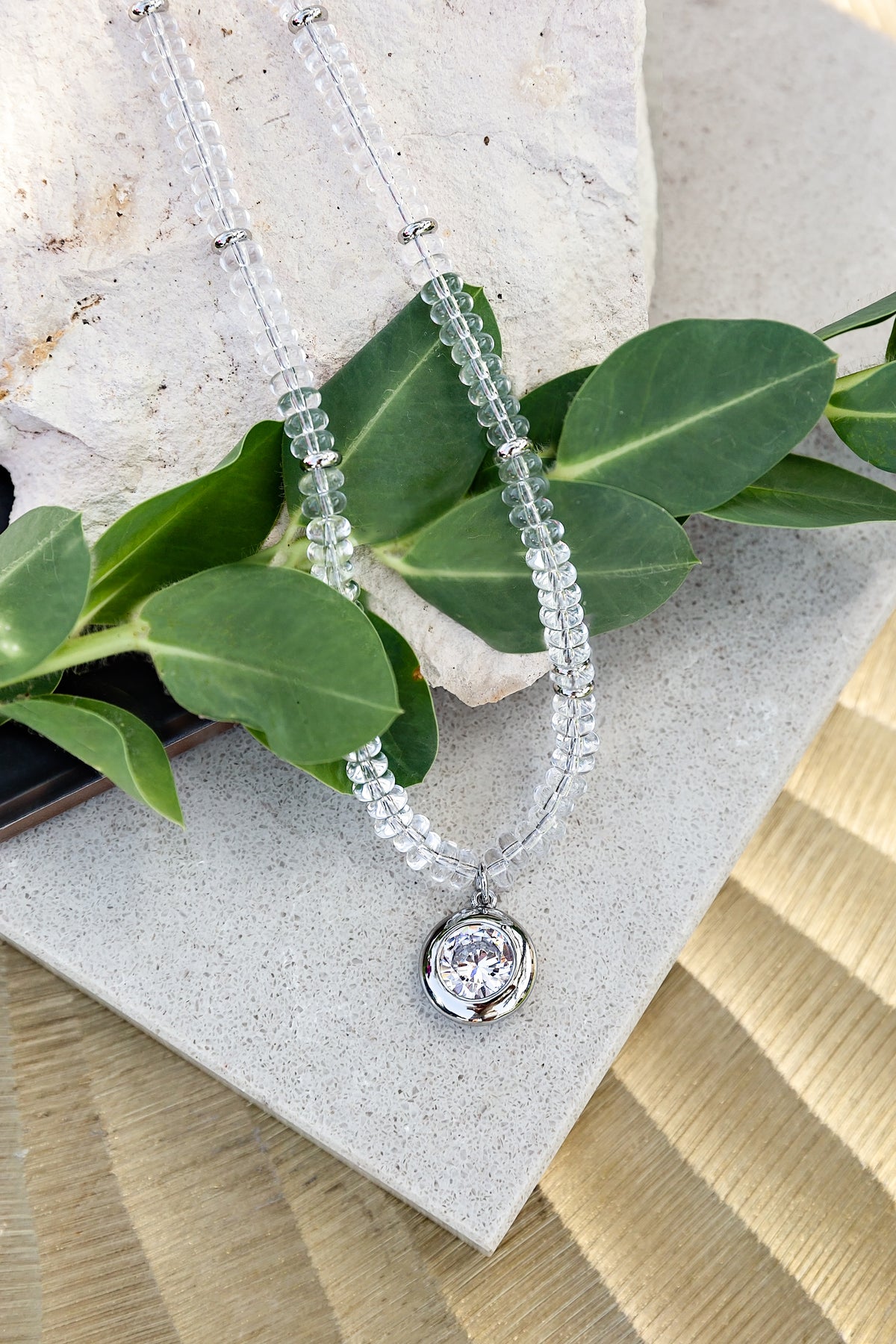 Luna Beaded Necklace from the LUNA Collection by VEITA Jewelry styled with clear glass beads and a sparkling zircon pendant.
