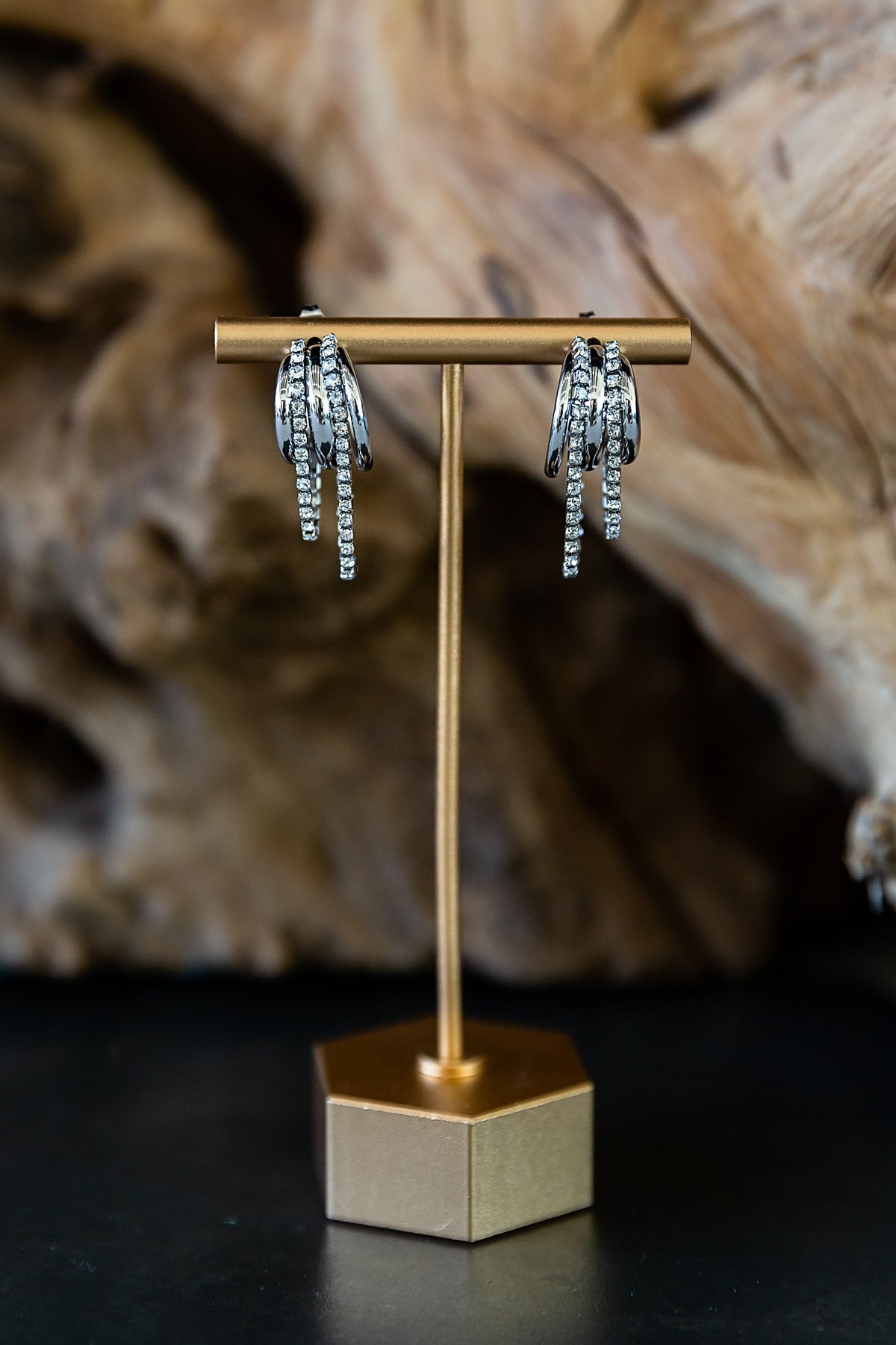 Close-up view of the Marisol Hoop Earrings showing the layered triple-hoop design and zircon details.