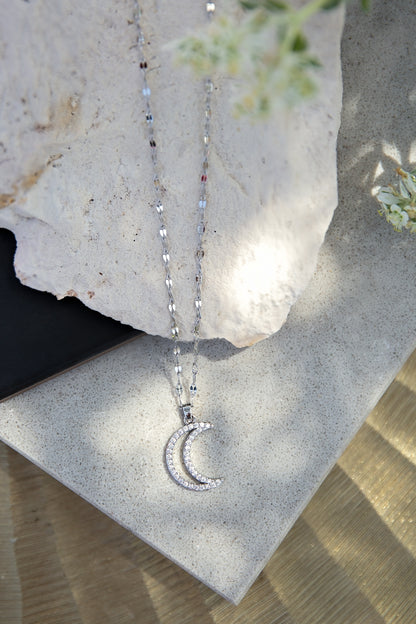 Moonbeam Necklace from the LUNA Collection by VEITA Jewelry featuring a zircon-studded crescent moon pendant on a delicate textured chain.