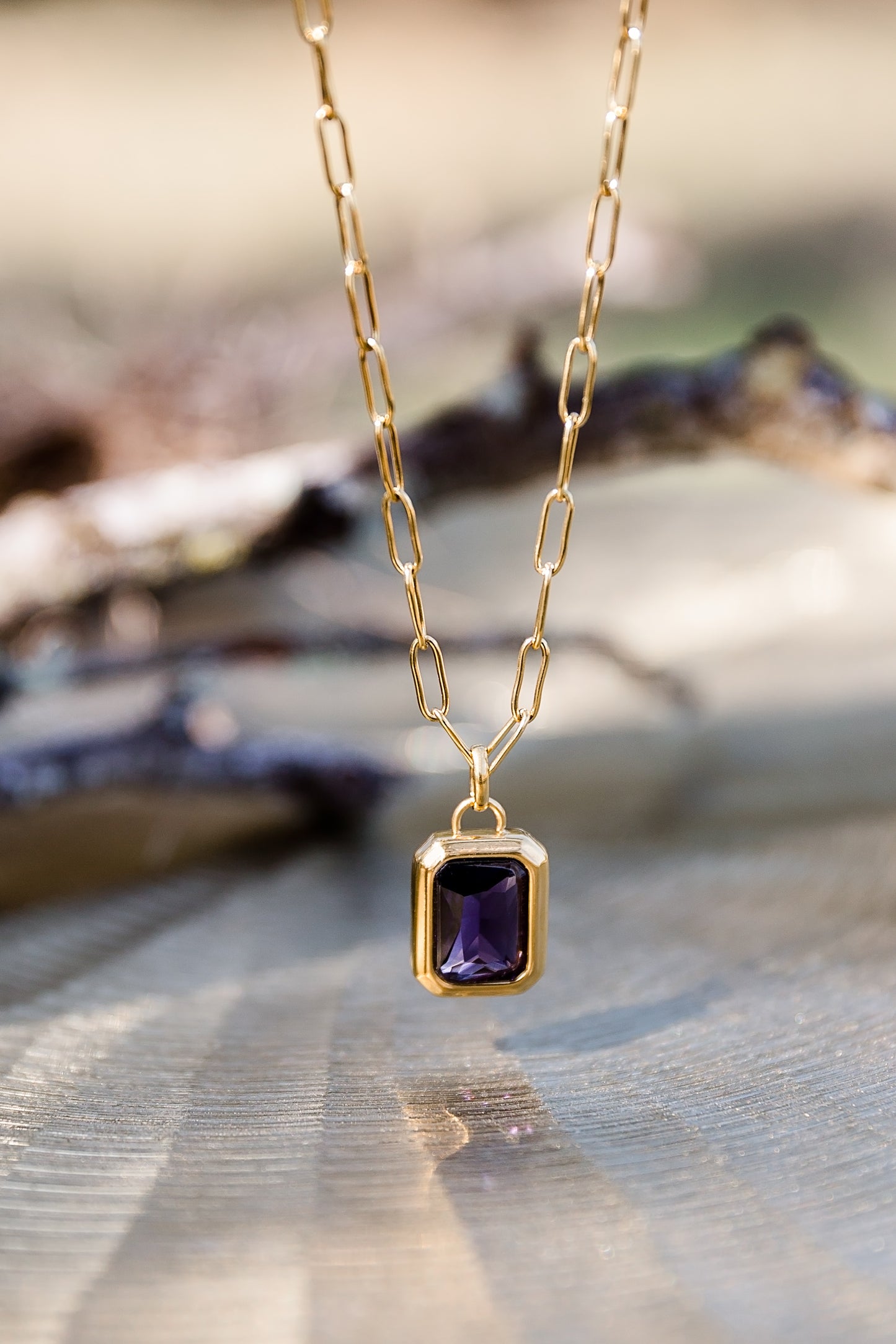 Nightfall necklace featuring gold chain with rectangular zircon pendant in deep tone for a refined minimalist look