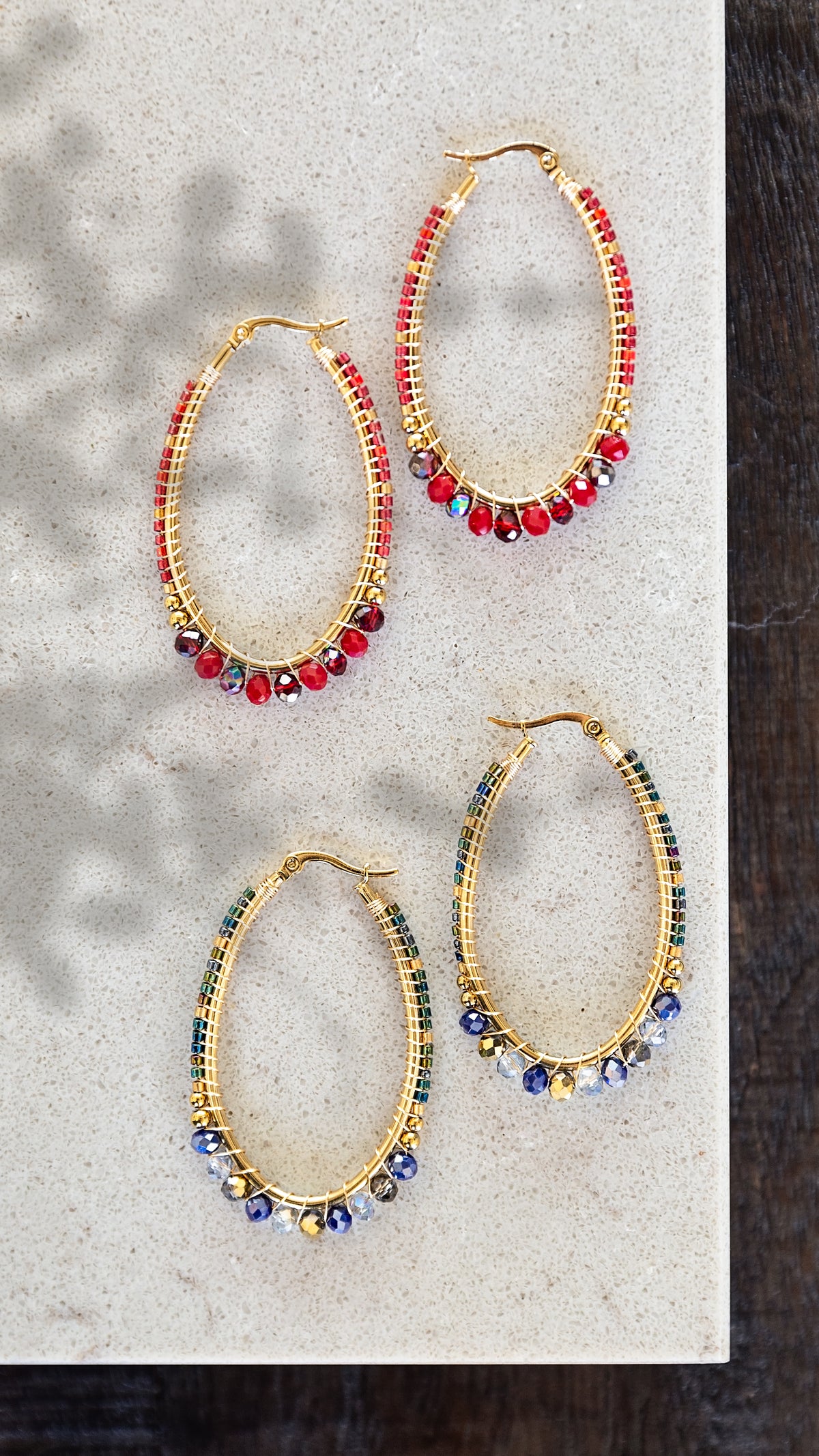 VEITA Jewelry Noemi Beaded Hoops featuring hand-beaded gold hoops in burgundy and blue colorways.