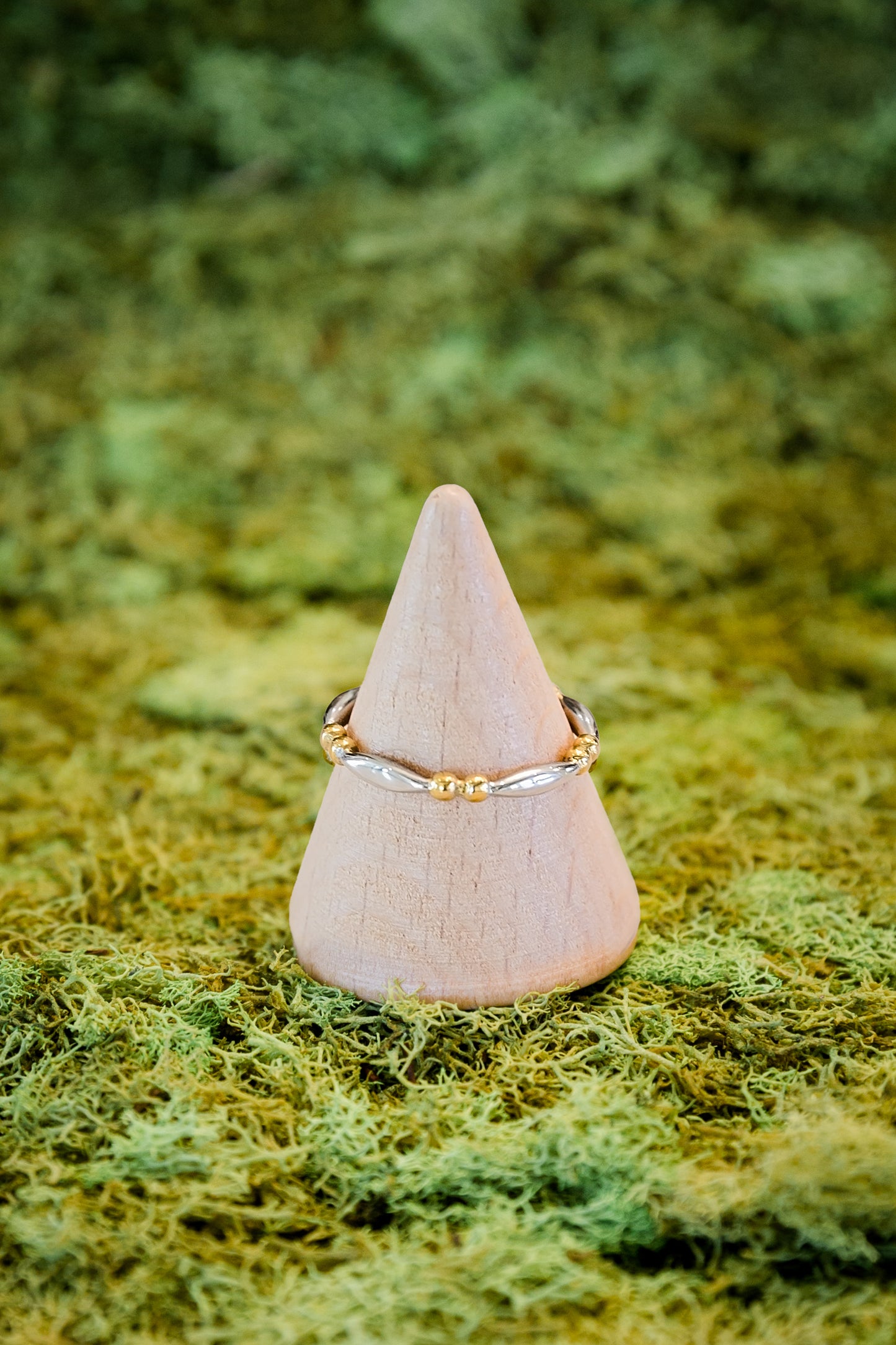 Nyx stacking ring featuring two tone gold and silver design with delicate beaded detail on stainless steel band