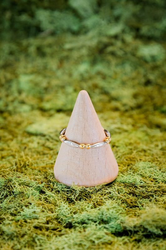 Nyx stacking ring featuring two tone gold and silver design with delicate beaded detail on stainless steel band
