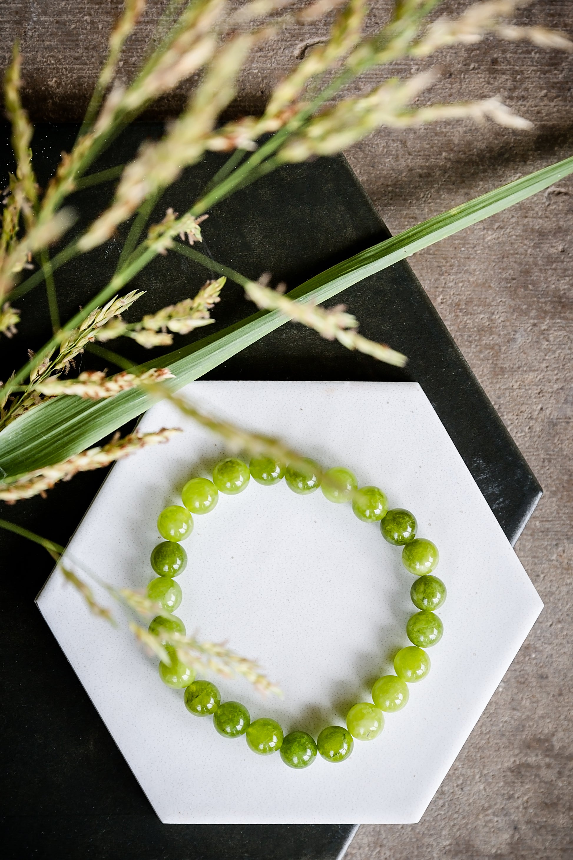 VEITA Jewelry Peridot Stretch Bracelet with genuine green peridot stones styled outdoors