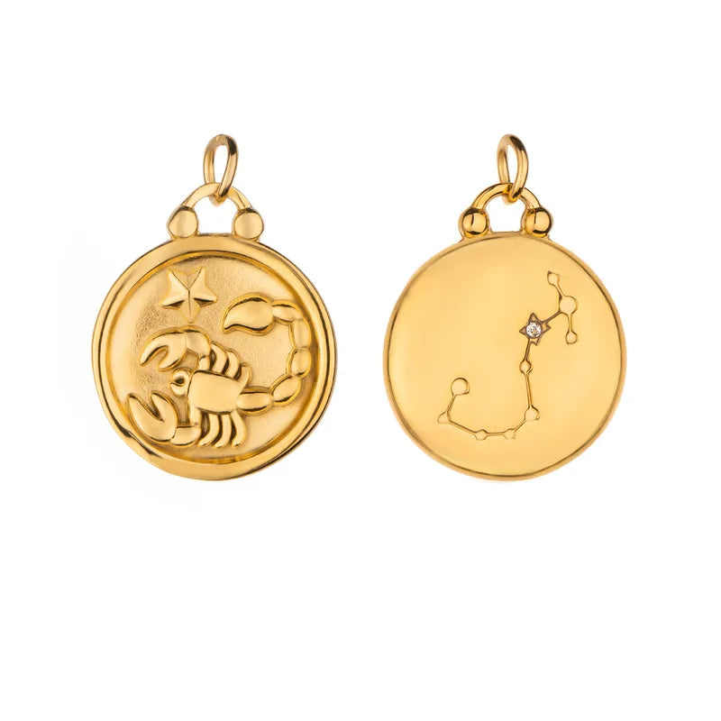 Front and reverse views of the Reversible Zodiac Necklace pendant from VEITA Jewelry, showing both sides of the gold plated zodiac design.