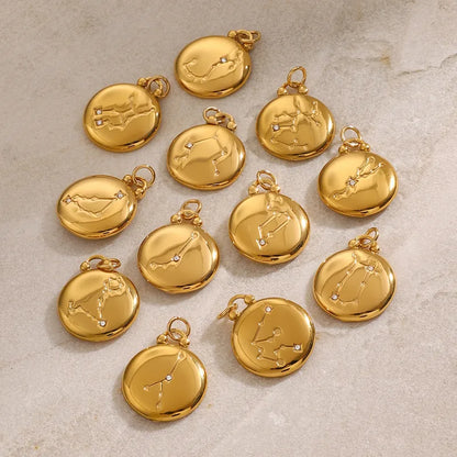 Assortment of gold plated Reversible Zodiac Necklace pendants by VEITA Jewelry showing the reverse side of the reversible designs.