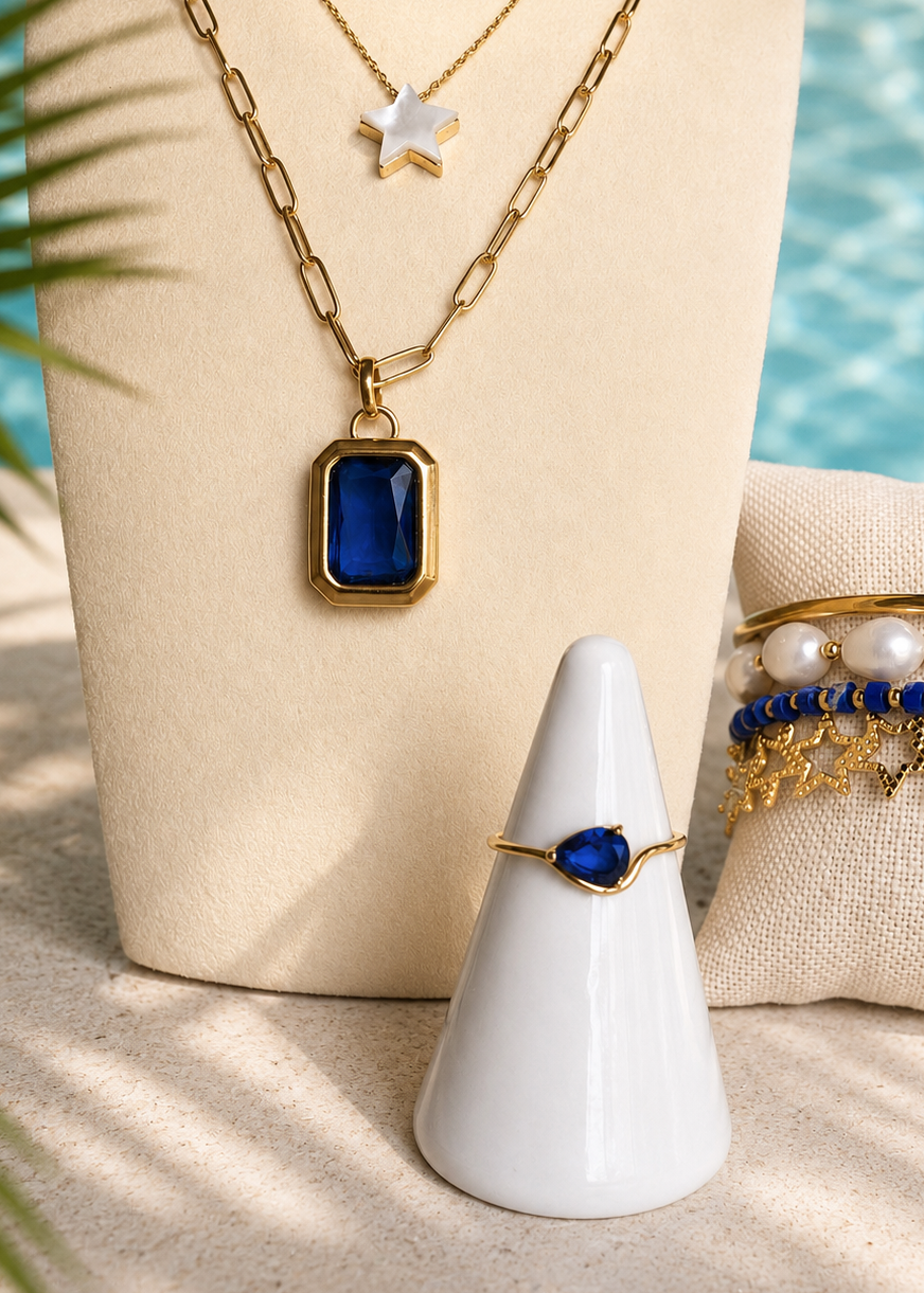 Rosie Ring styled with coordinating gold jewelry in a beach-inspired summer setting.