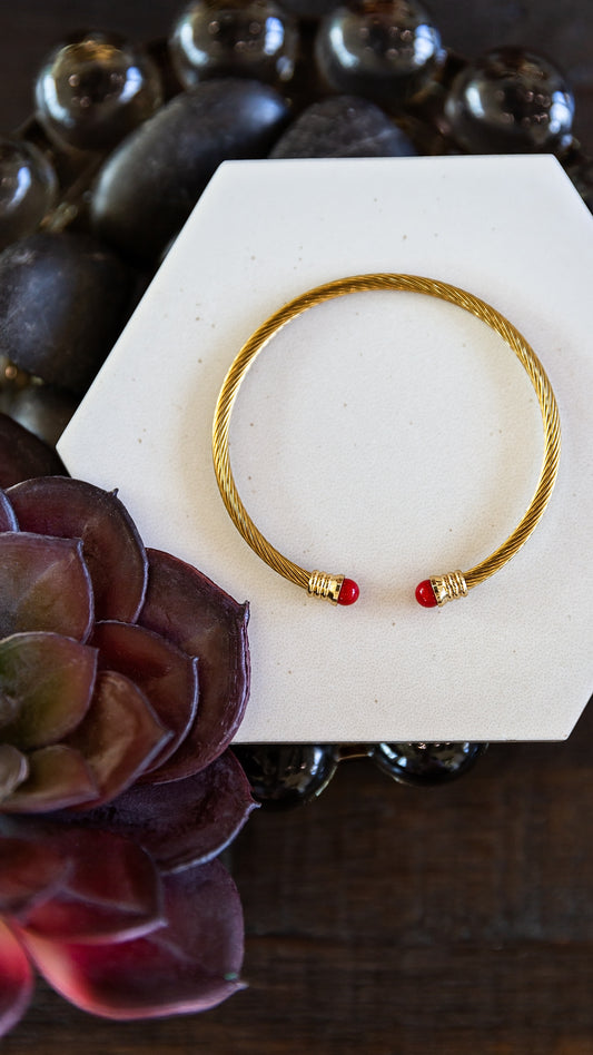 VEITA Jewelry Rouge Cuff featuring a slim gold design with red accent details