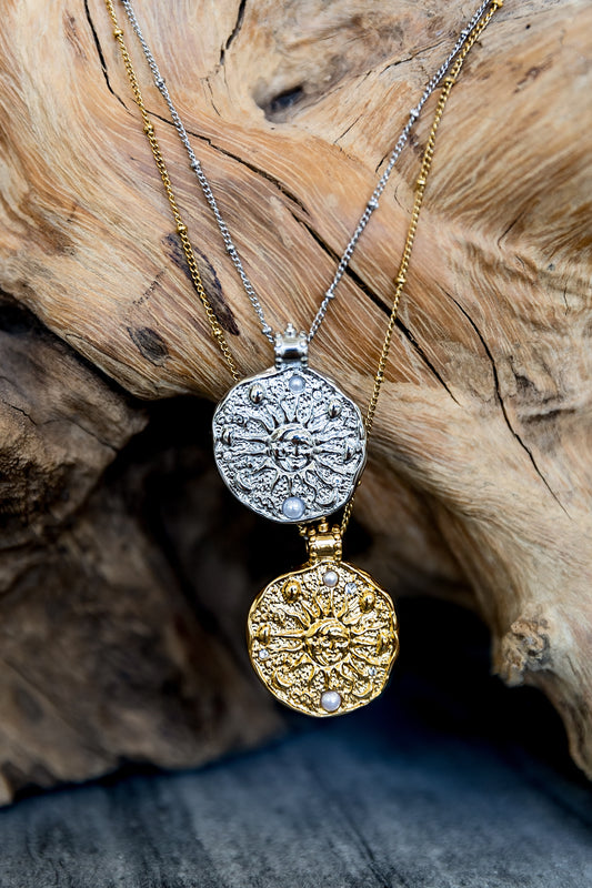 VEITA Jewelry Solana Necklace shown in gold and silver with round celestial sun and moon pendants