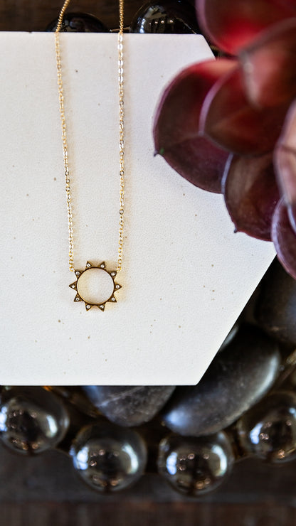 VEITA Jewelry Solstice Necklace featuring a delicate gold sun pendant accented with micro zircon stones