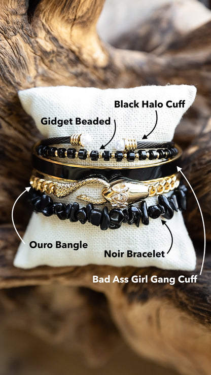 Bracelets stacked on pillow for the fall 2026 collection.