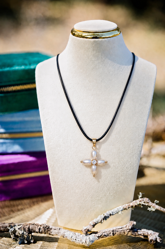 Necklace with a star-shaped pendant on a mannequin bust against a blurred background