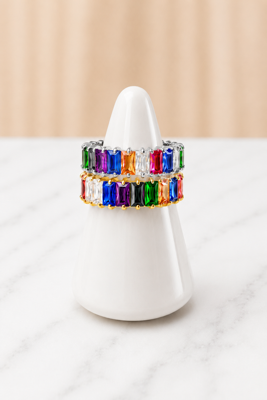 Fiona Rainbow Ring with multicolor baguette gemstones on a white ring stand
