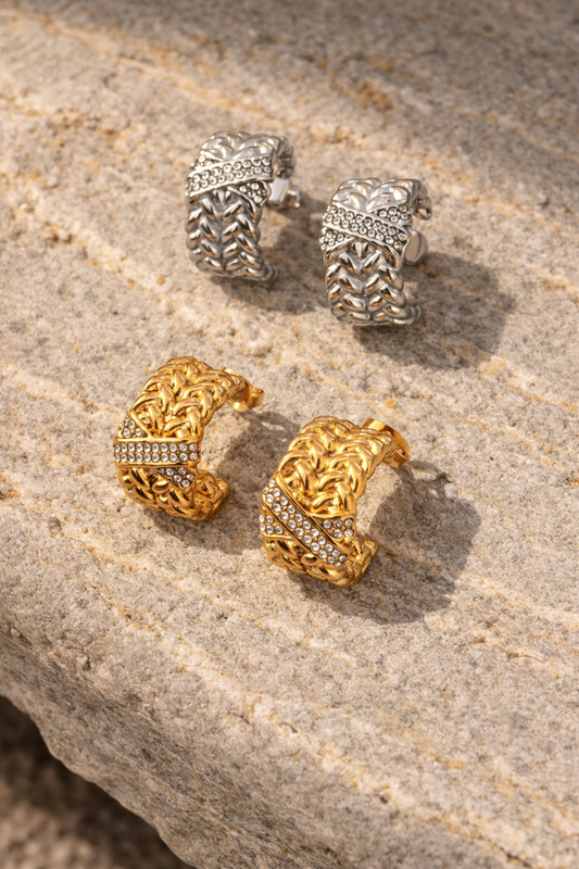 VEITA Jewelry chunky woven braided hoop earrings with pavé CZ stones shown in gold and silver options on stone surface