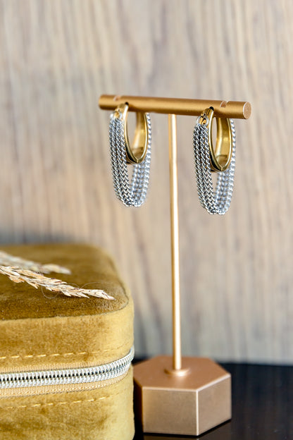 VEITA Jewelry gold hoop earrings with silver chain fringe displayed on gold earring stand next to mustard velvet jewelry box