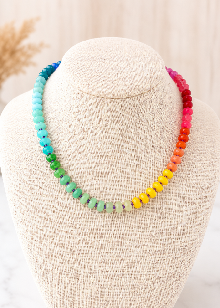 Rainbow Natural Stone Necklace with colorful beaded stones displayed on a linen jewelry bust